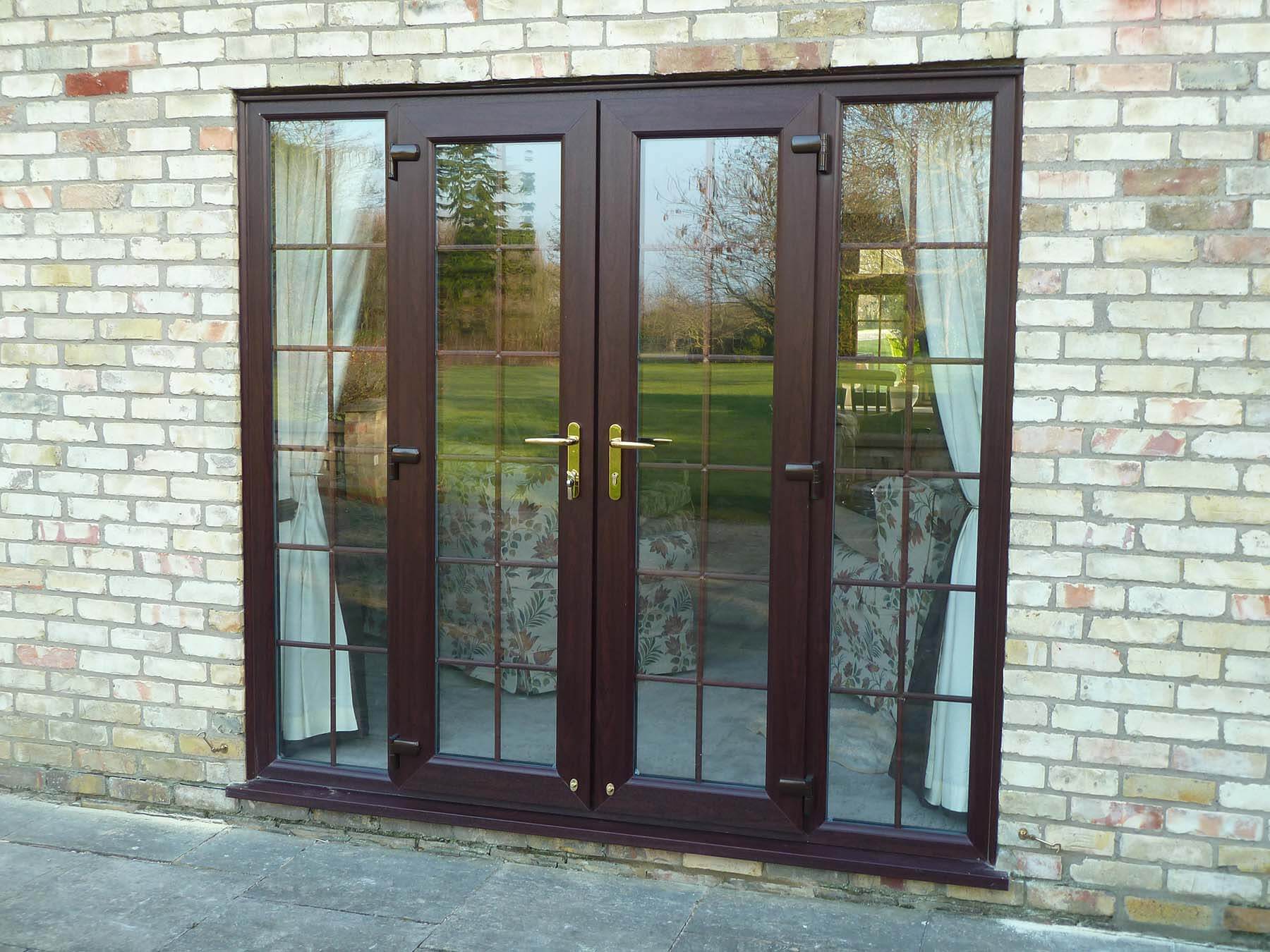 brown french doors with panels
